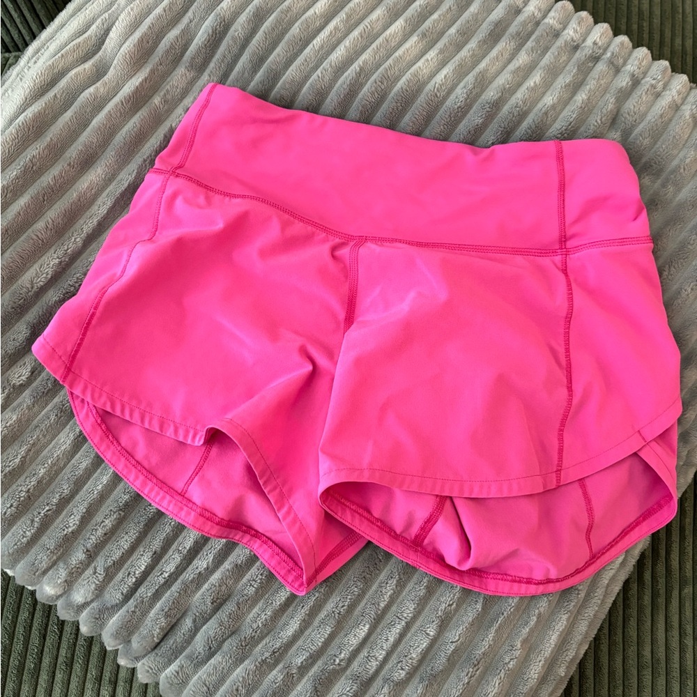 Lululemon neon pink running shorts in size 2